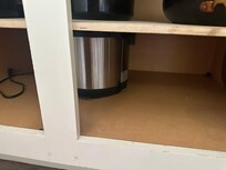 Air fryer holding up shelf.