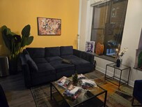 Seating area in the main living space. There is a pit sofa.