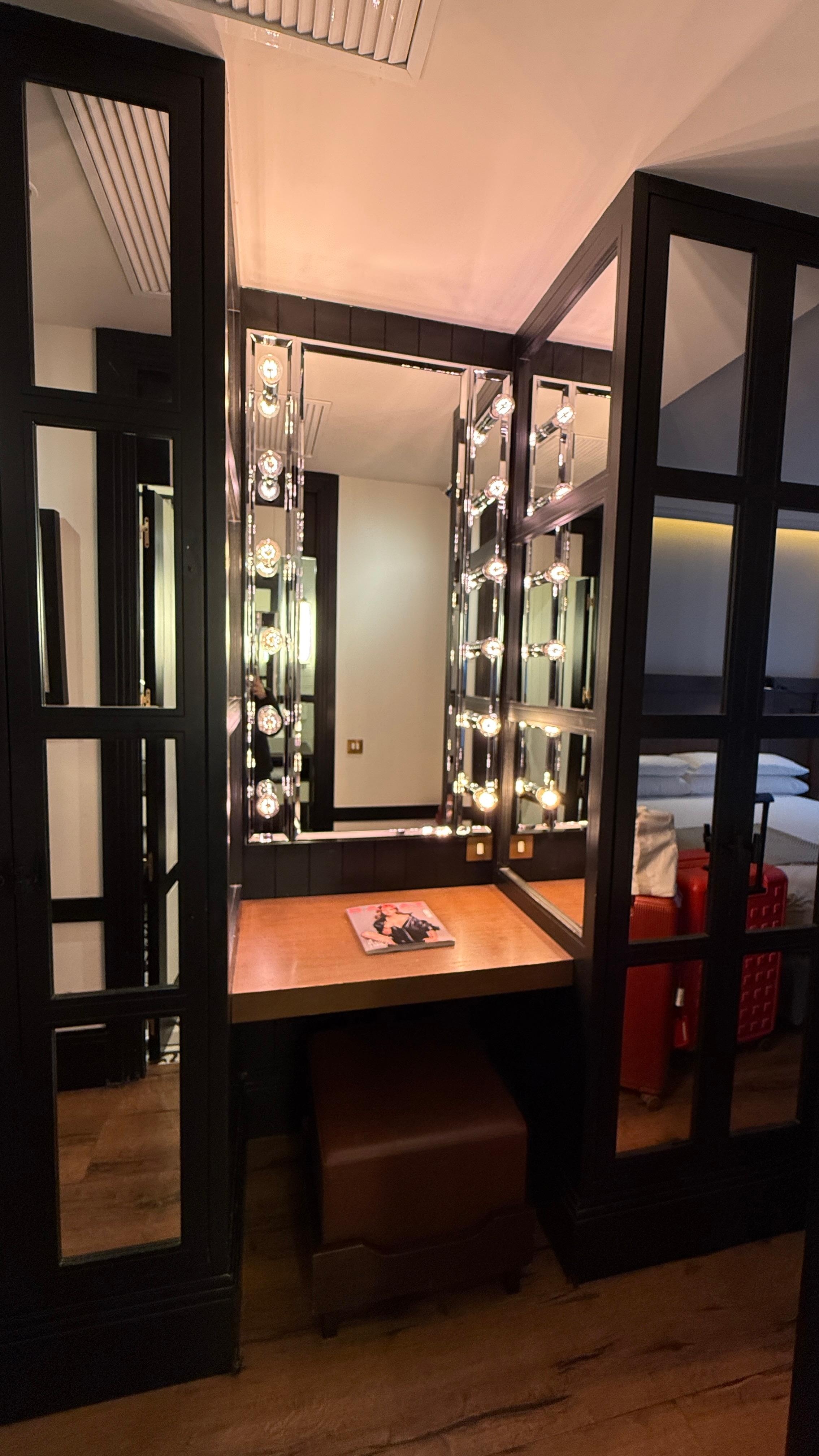 A nice touch to have a carved out dressing table that is well lit