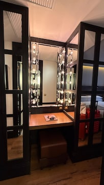 A nice touch to have a carved out dressing table that is well lit