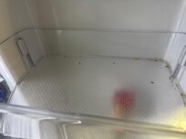 Filthy fridge shelf