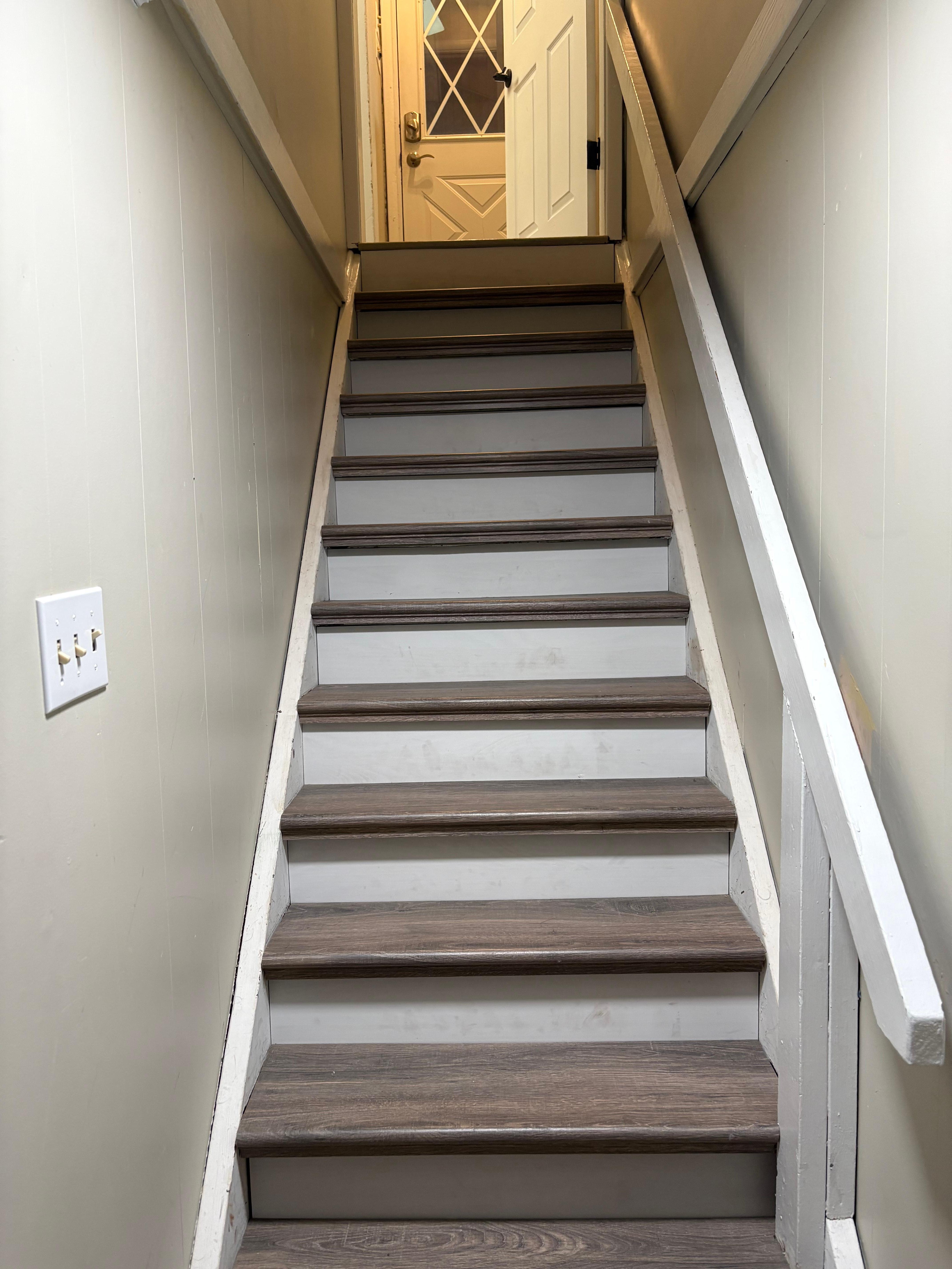 Stairs to finished basement. Own bedroom and bathroom and tv with wrap around couch