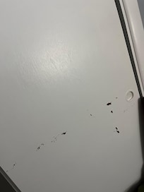 Chipped paint on a closet door.