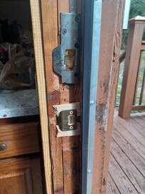 Close-up of entrance door in need of repair