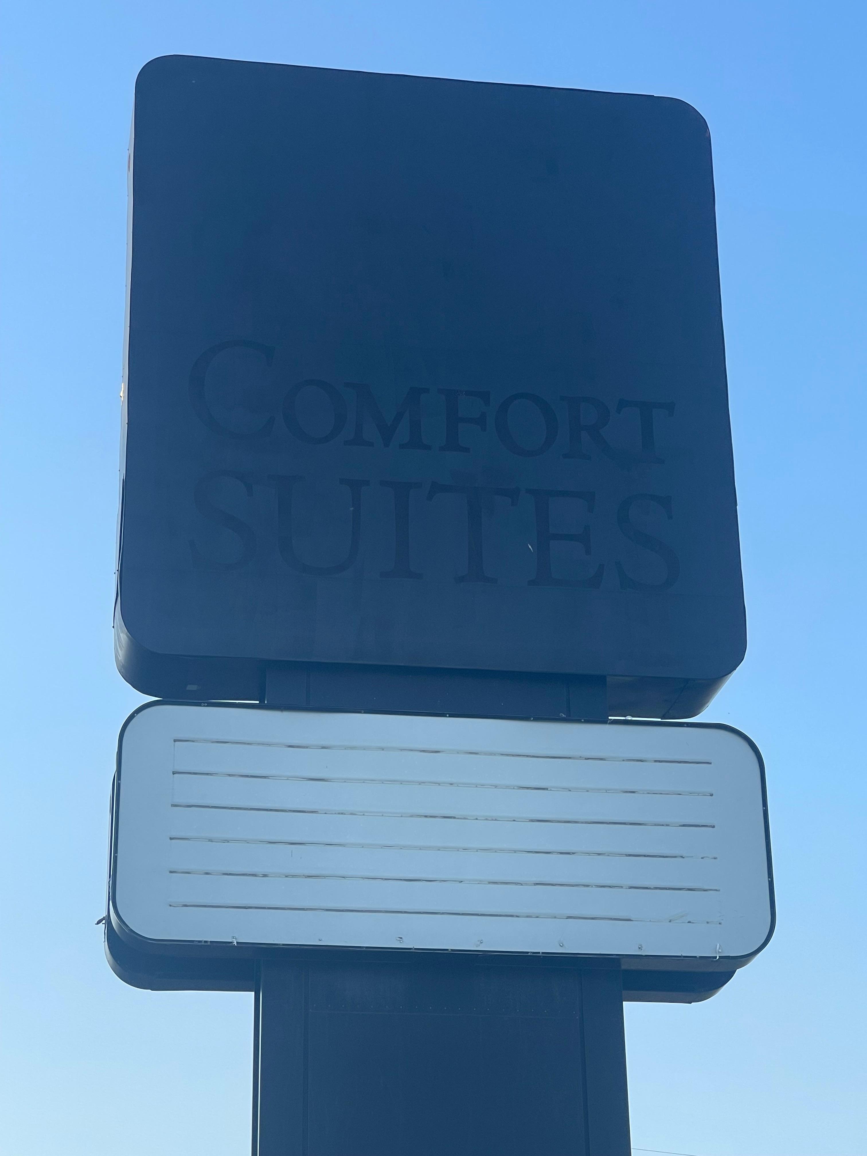 Comfort Suites sign painted over.