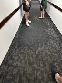 Water damage on the floor after the sprinkler system went off for a fire in a unit multiple floors up