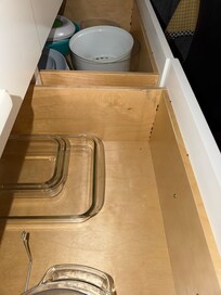 Roach bait inside drawer next to utensils.