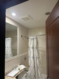 Bathroom vent where cigarette smoke came in from other room of smoker .