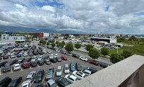 View of the long-term parking from the balcony with the control tower in the background