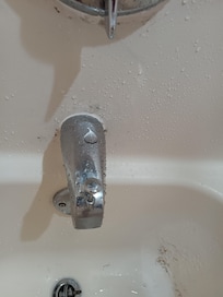 Dirt or mold around tub faucet