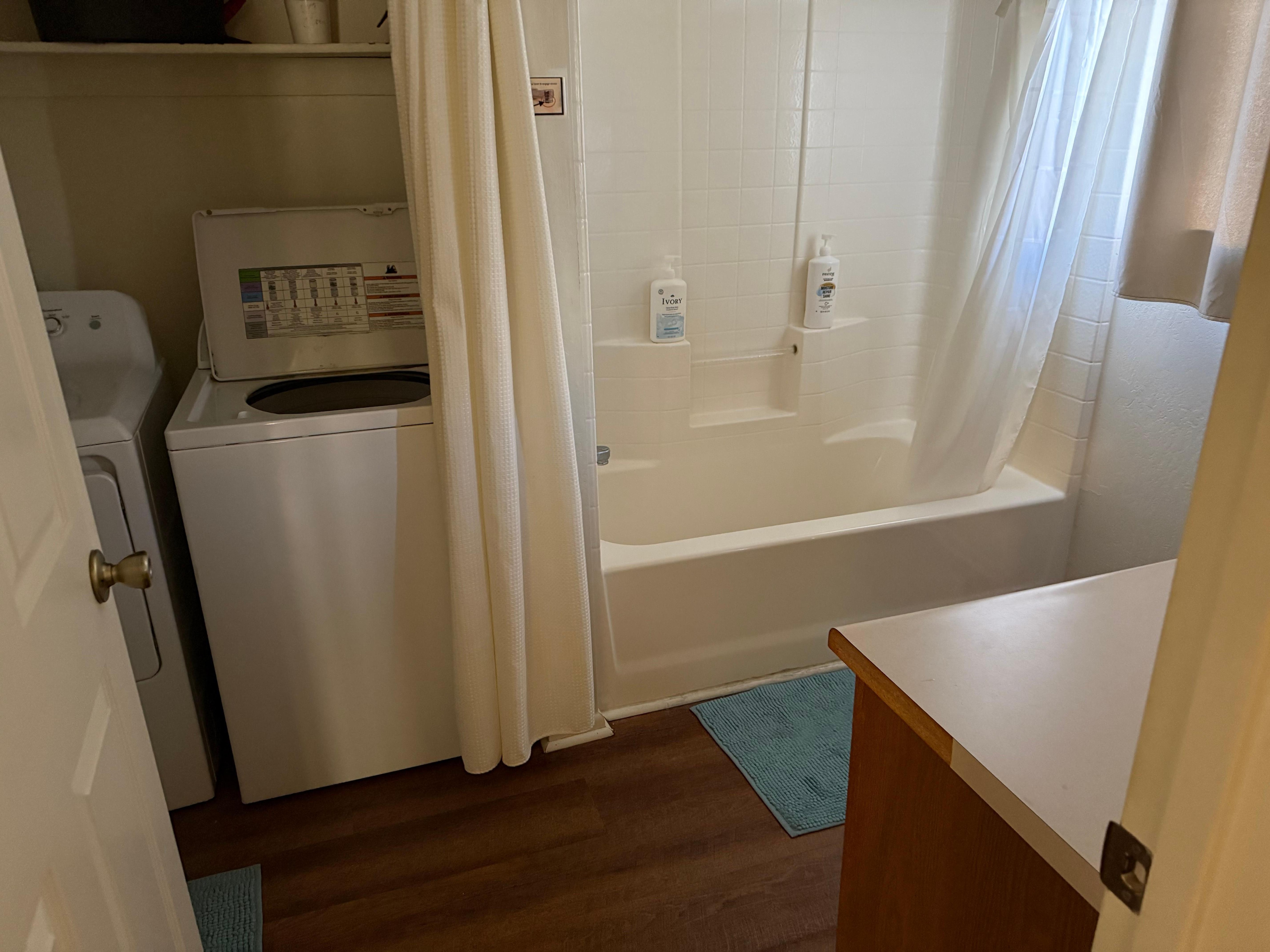 Washer, dryer, laundry supplies shared with bathroom