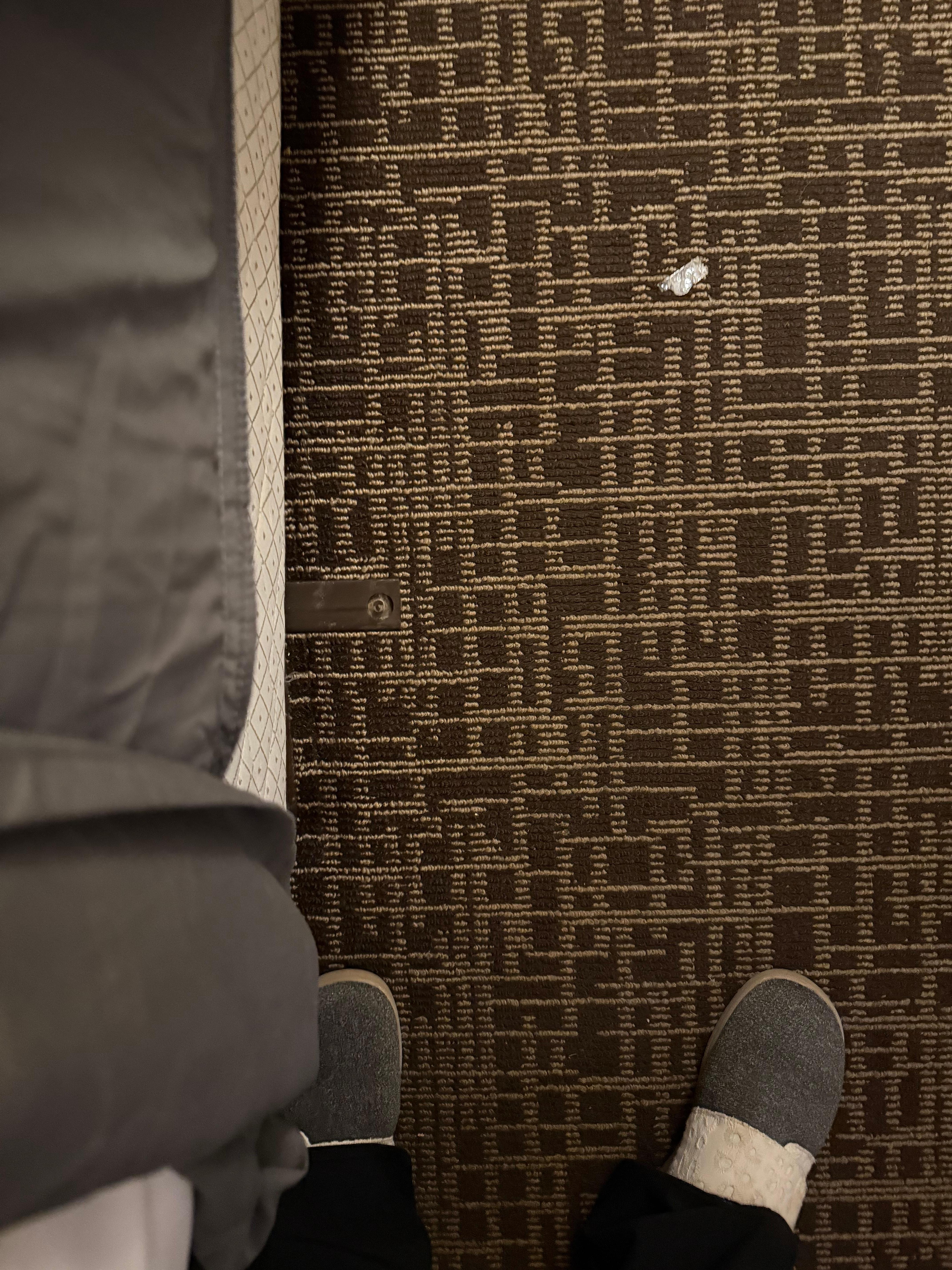 Metal pieces at foot and head of bed areas. 