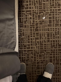 Metal pieces at foot and head of bed areas.