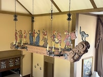 A whimsical light fixture over the dining table