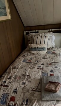 One of 3 twin-sized beds in upstairs bedroom