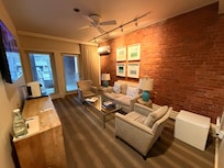 Amazing sitting room as you walk in. with the door to the private porch.