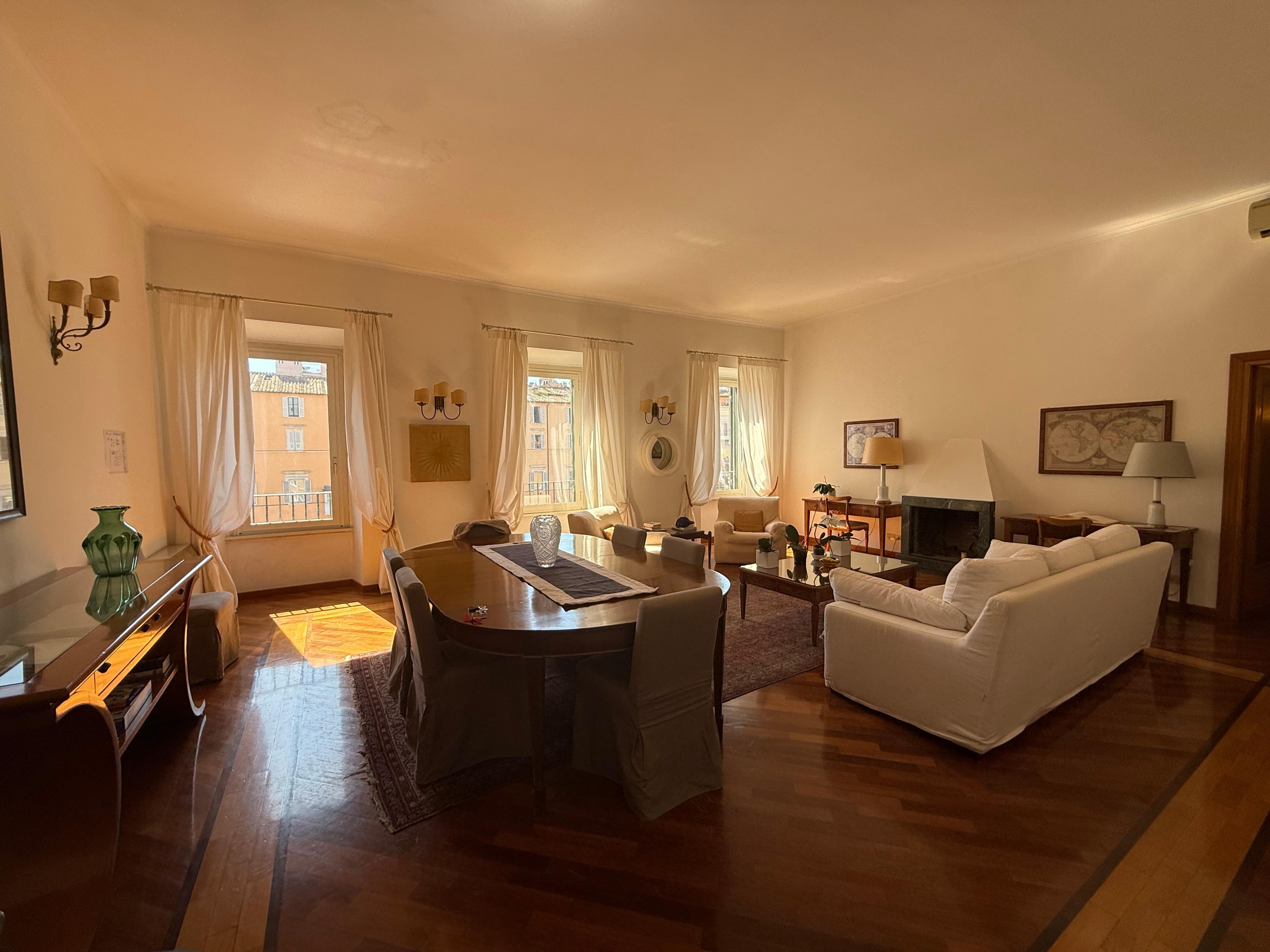 Stunning living room with windows opening to Piazza Navona