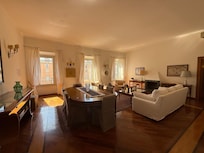 Stunning living room with windows opening to Piazza Navona