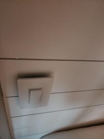 Unsecured light switch next to hallway bunk beds.