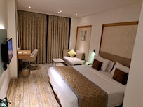 Room with Extra large King Bed and seating space in sofa