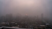 Sunrise through the fog looking east from the balcony