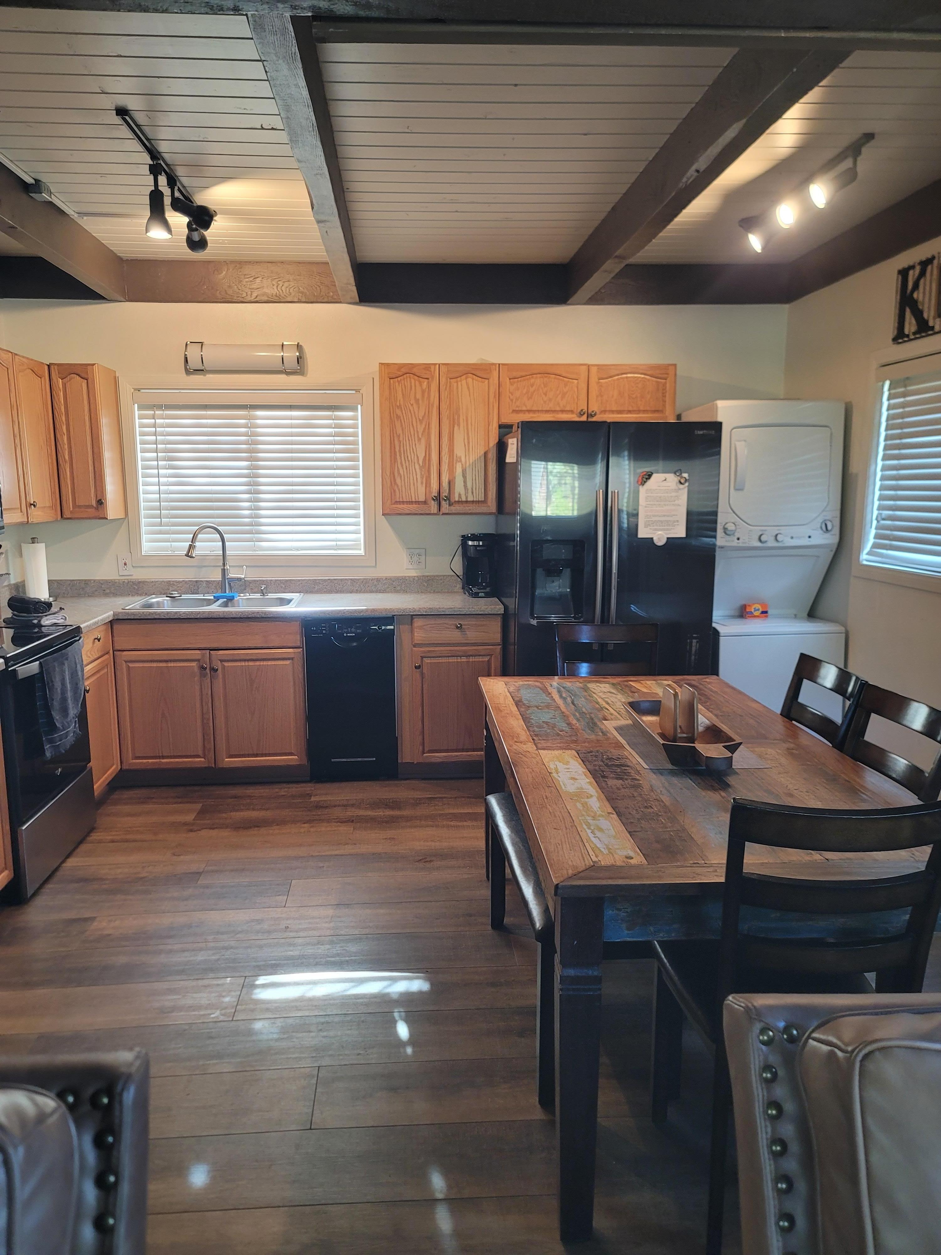 The larger dining table with bench seating made family meals and games easier to enjoy.