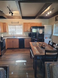 The larger dining table with bench seating made family meals and games easier to enjoy.