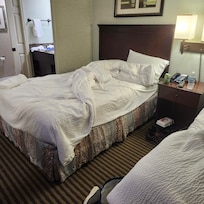 Beds side by side, on the other side of the furthest bed was the window outside...you could barely walk between bed and window to get into the bed.