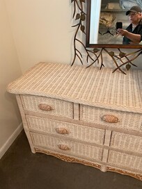 The color of this dresser is from age. The owner is very defensive about the quality of her home.