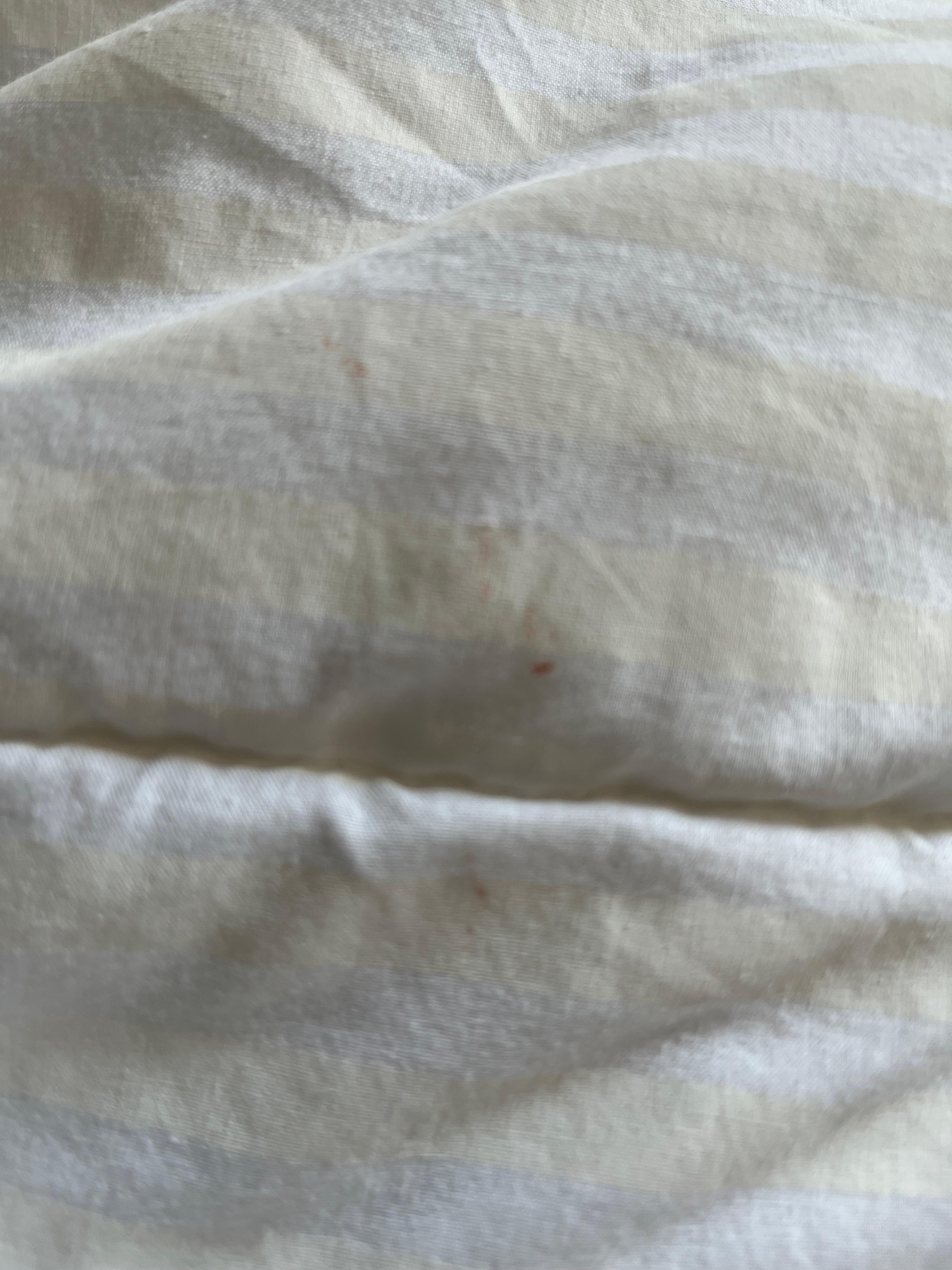 Dirty bed linen blood stains 