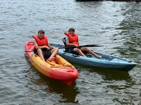 Young family members kayaking