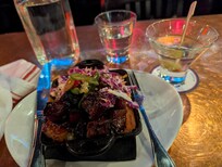 Checked in just in time for Happy hour next door... Great food, wonderful location