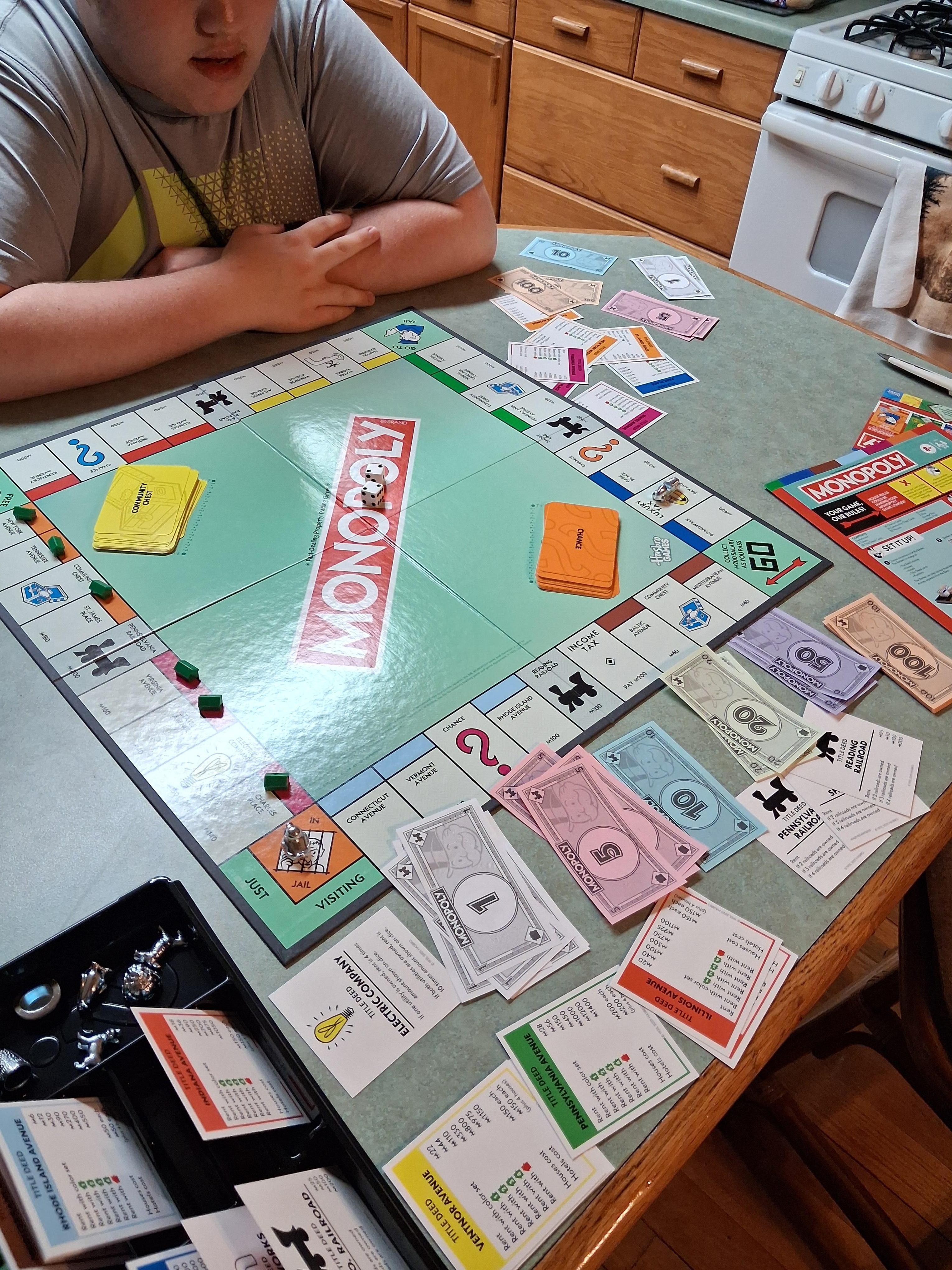My son kicking my butt at Monopoly. 