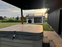 Backyard hot tub and rooftop deck