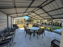 Spacious backyard patio with lots of seating
