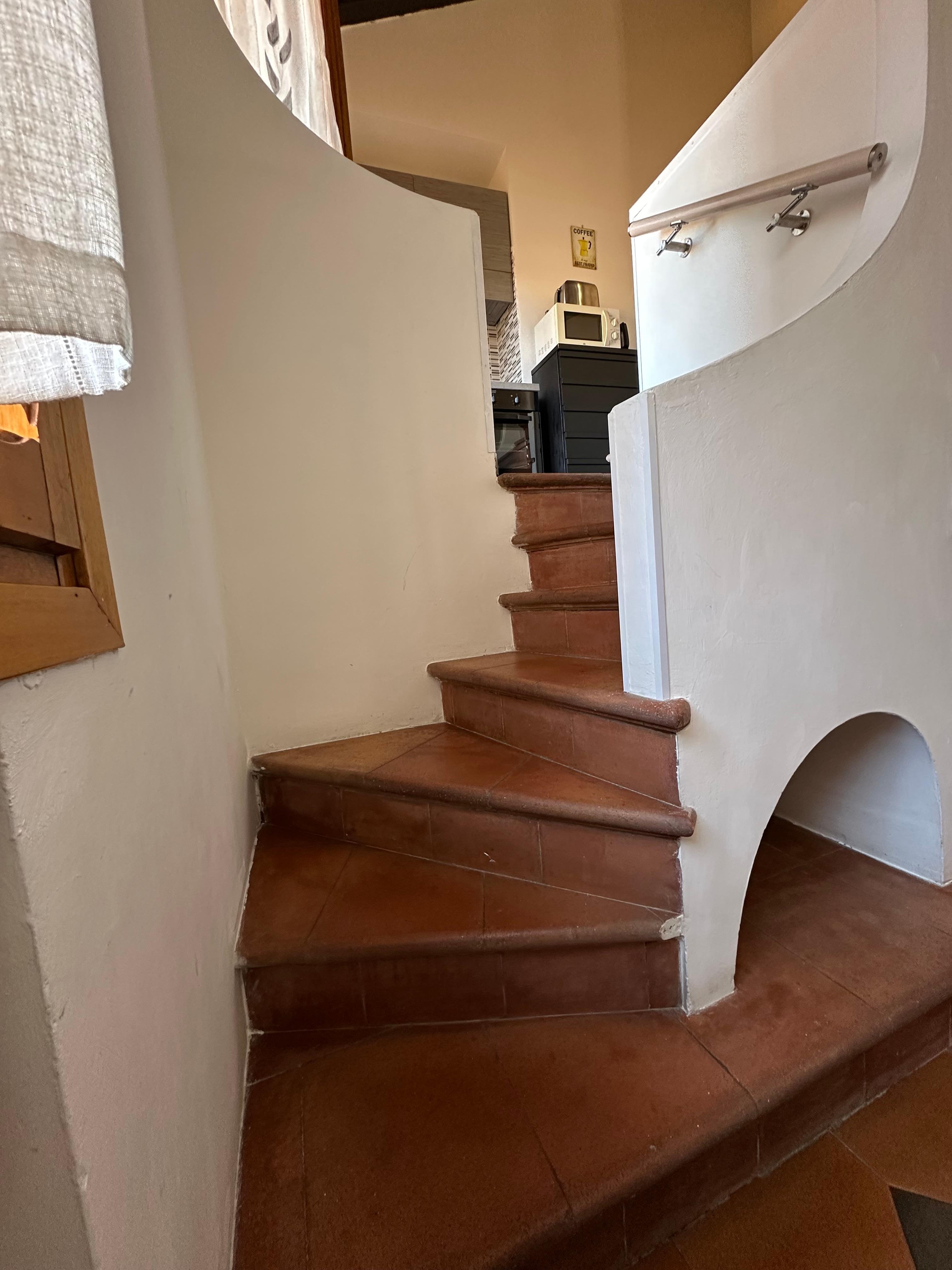 Stairs to kitchen and bedroom
