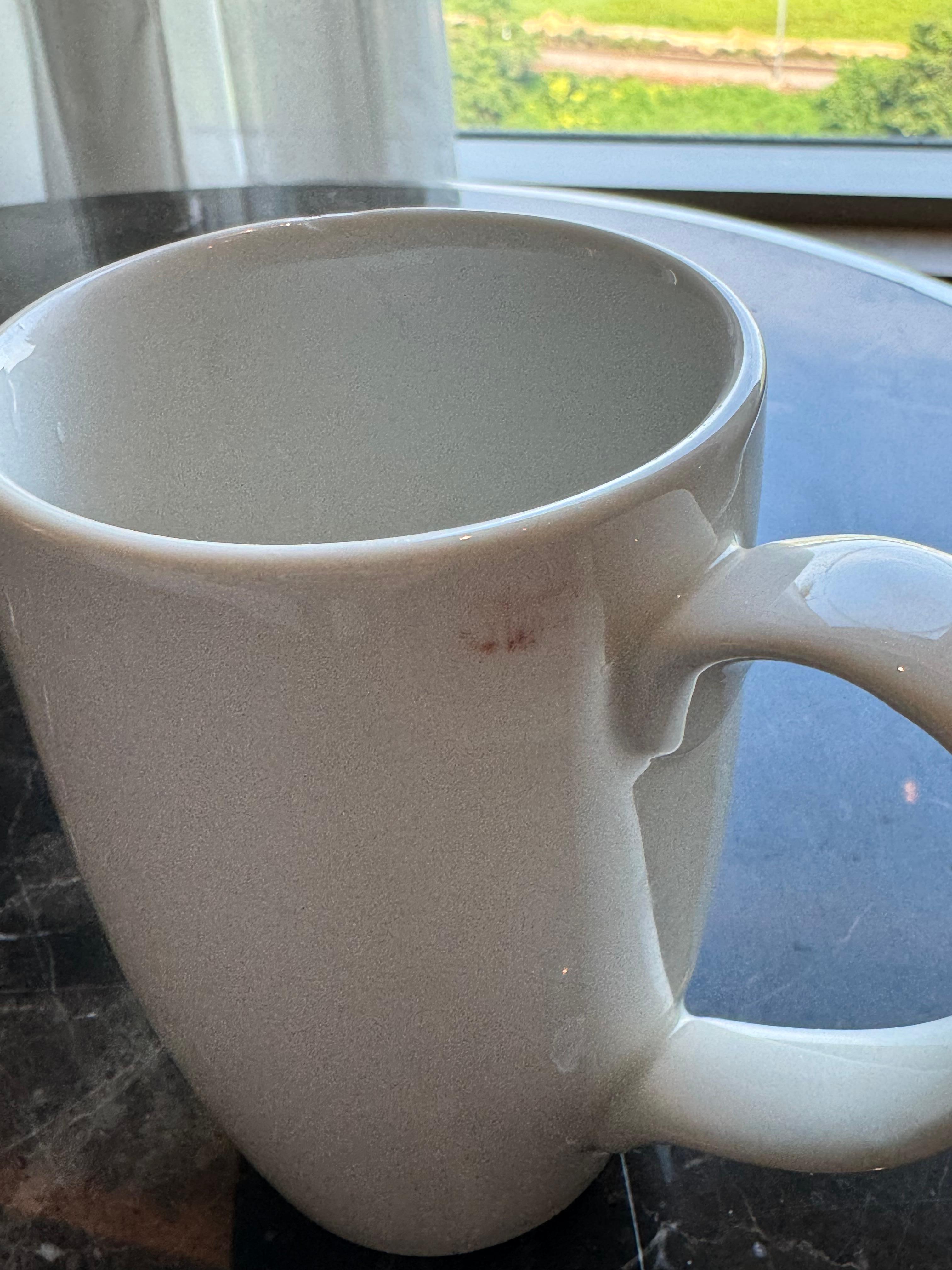 Unwashed cup in my room with a lipstick mark