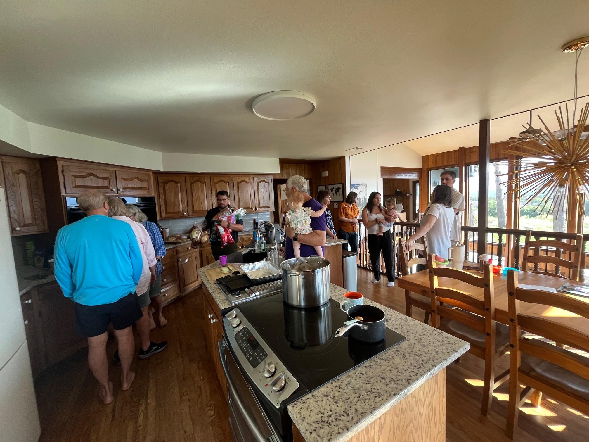 A little over half the crew preparing supper our first night in