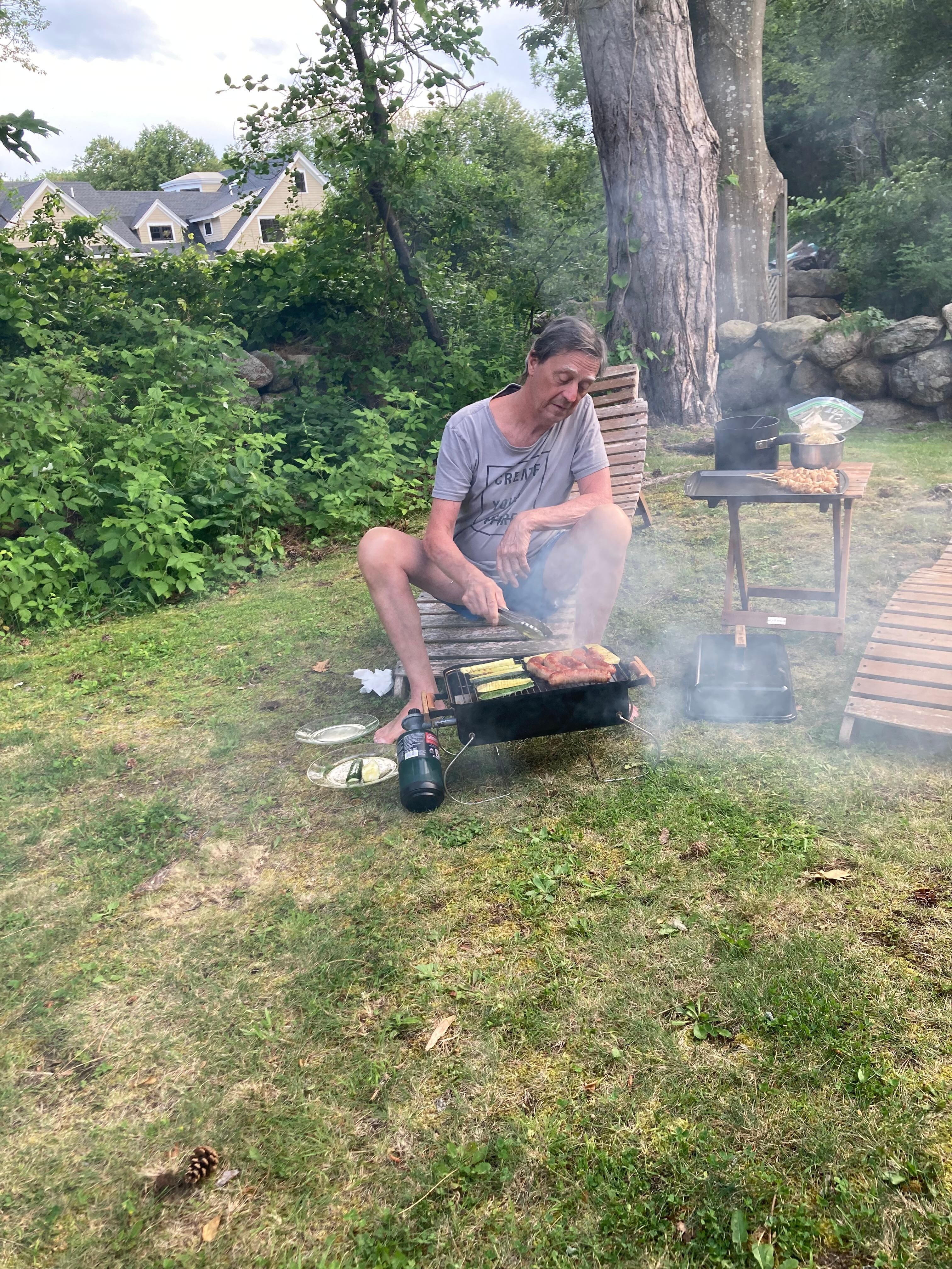 Mark using the bbq grill. He really enjoyed it. 