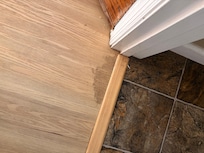 Floor by toilet door