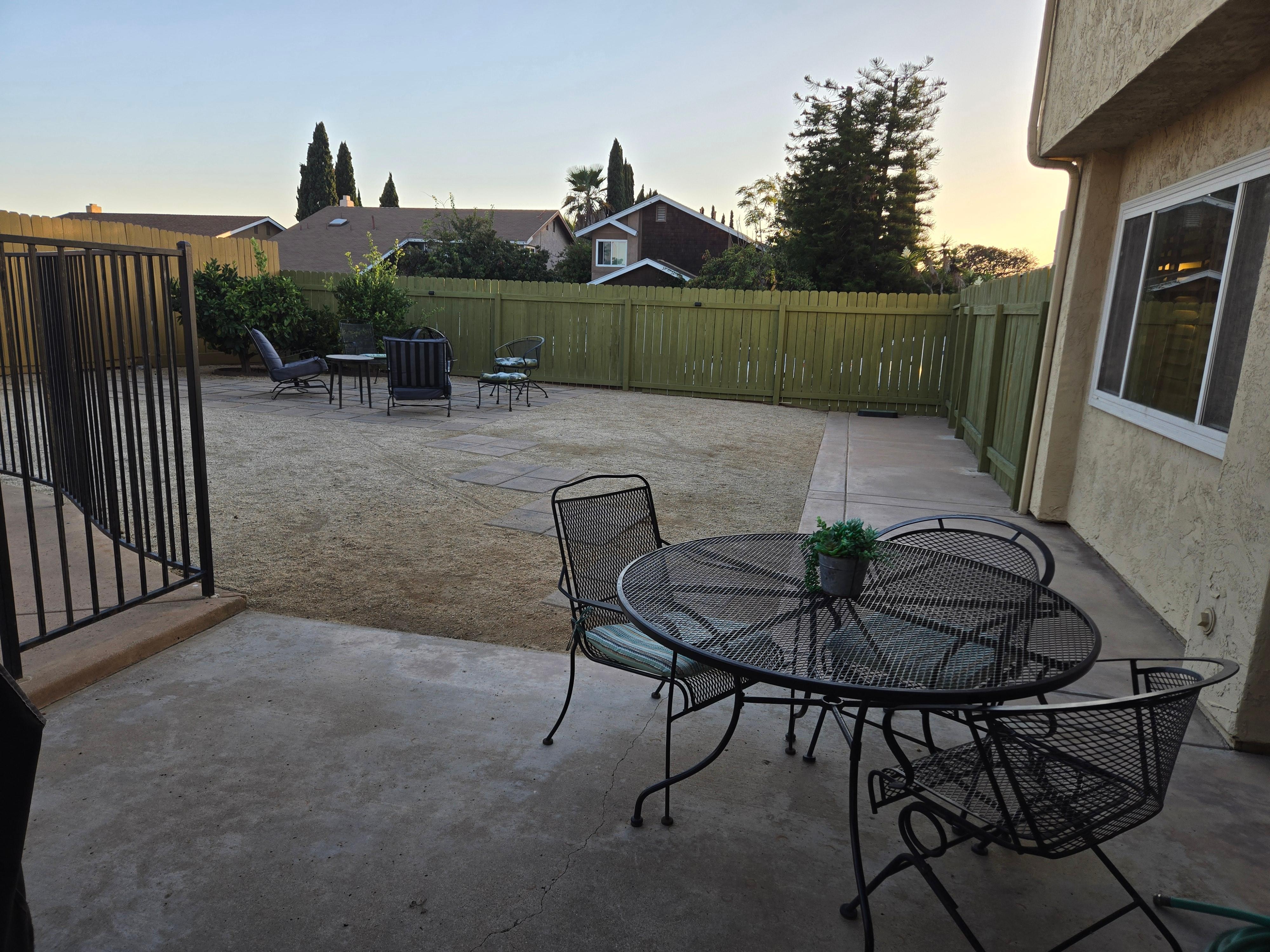 This table isto the right of the grill. Great place to put your cutting board, bowls of veggies and plates of food to grill. In the background is a comfy seating area around the fire pit!!