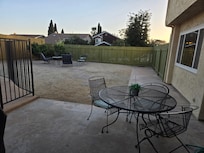 This table isto the right of the grill. Great place to put your cutting board, bowls of veggies and plates of food to grill. In the background is a comfy seating area around the fire pit!!