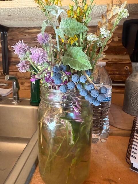 Flowers on the counter. 