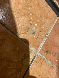 Cigarette ashes left on floor.