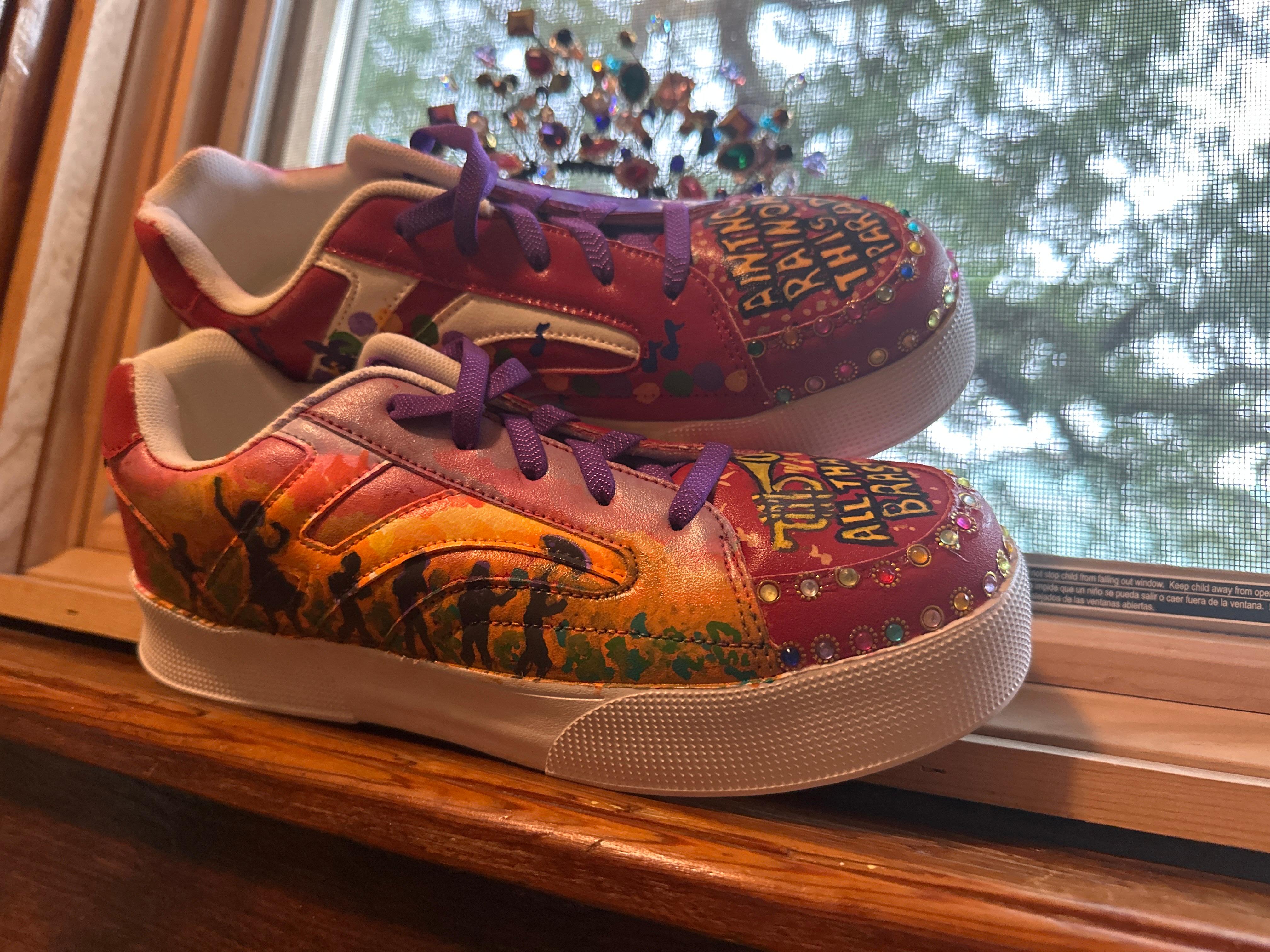 Shoes I painted and wore to Jazz Fest in the window facing Governor Nicholls, the Live Oak, and St Augustine Church