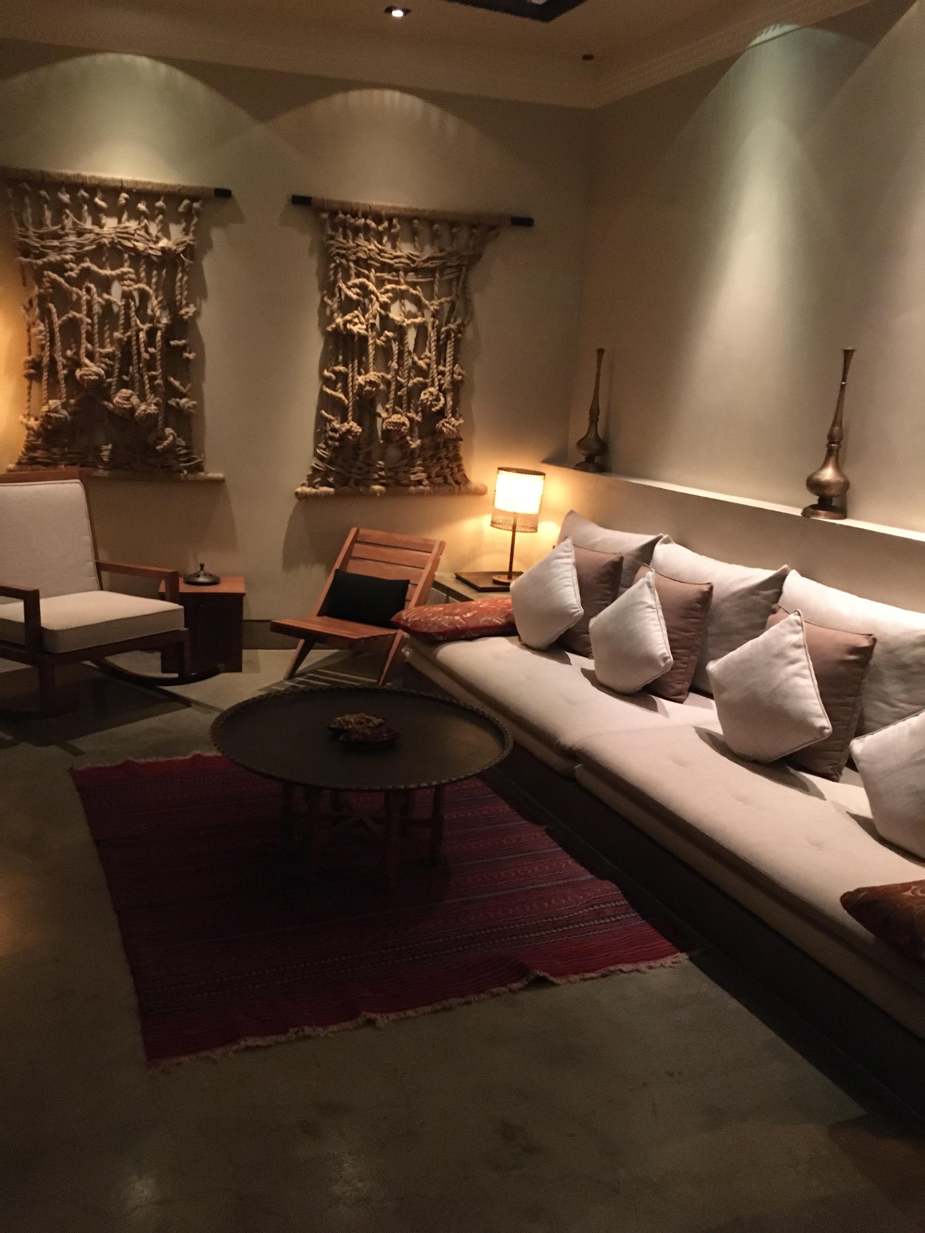 Living room area of the suite. Snacks on the table and a small coffee/ tea bar in suite for your needs. 