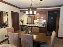 Full kitchen and dining room.
