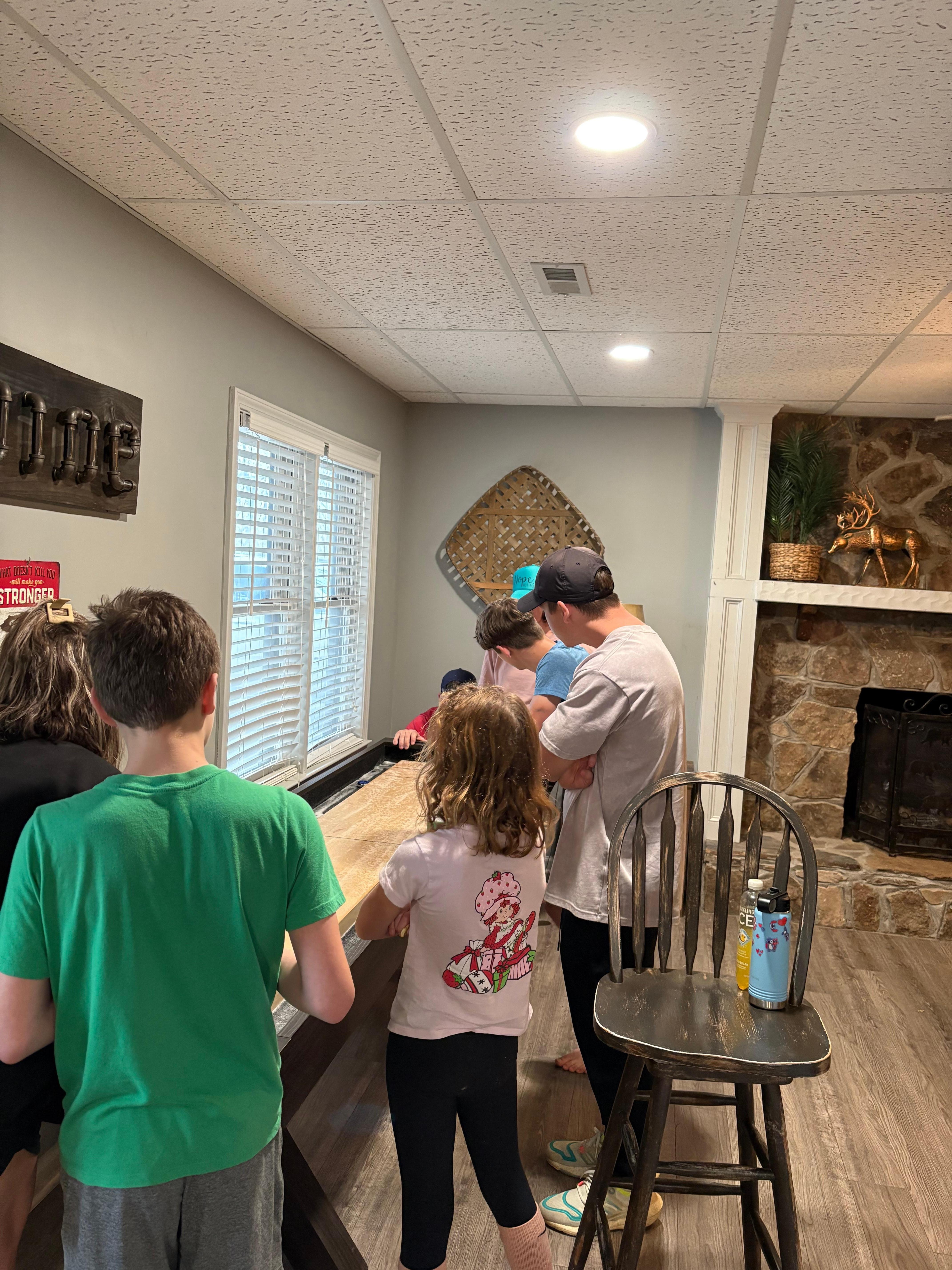 Love this game. It’s like shuffle board/curling on a table. We had a family tournament!!