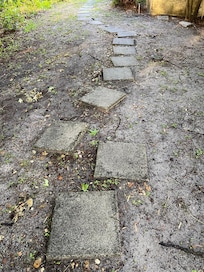 Unsafe pavers and poor lighting at nite