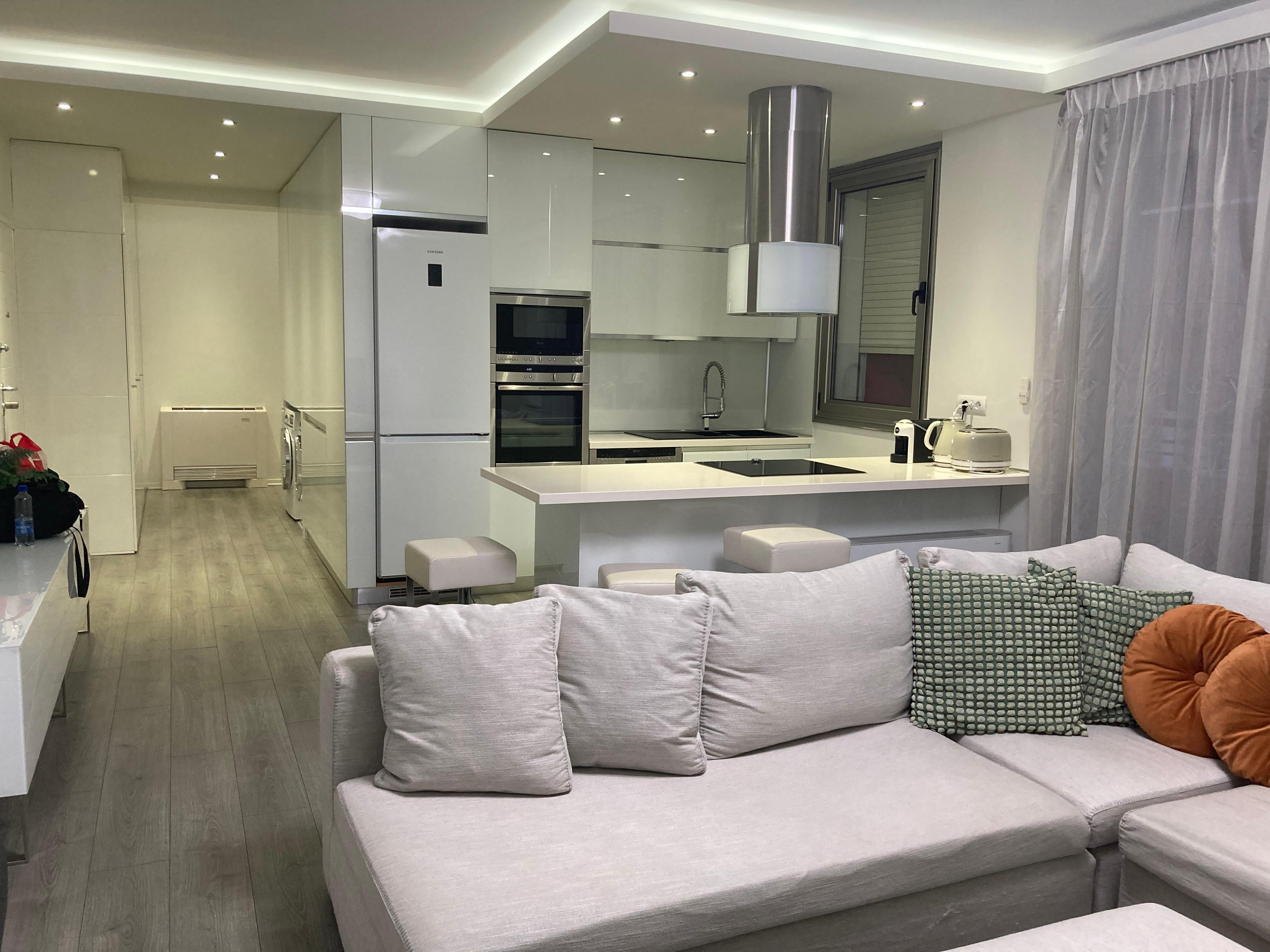 Lounge/kitchen leading onto balcony 